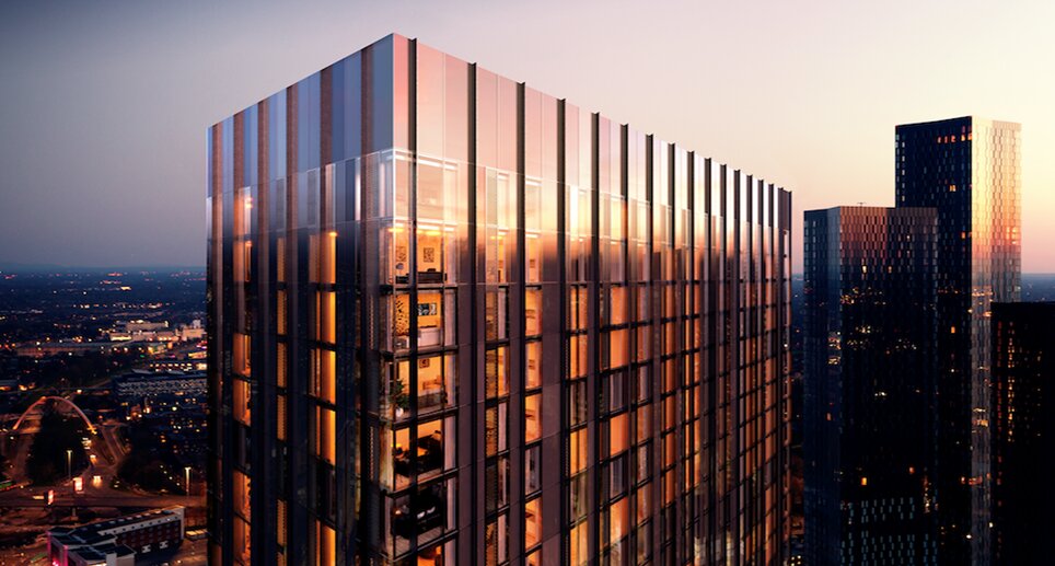 Modern residential building with glass facade and illuminated interiors, set against a twilight skyline.