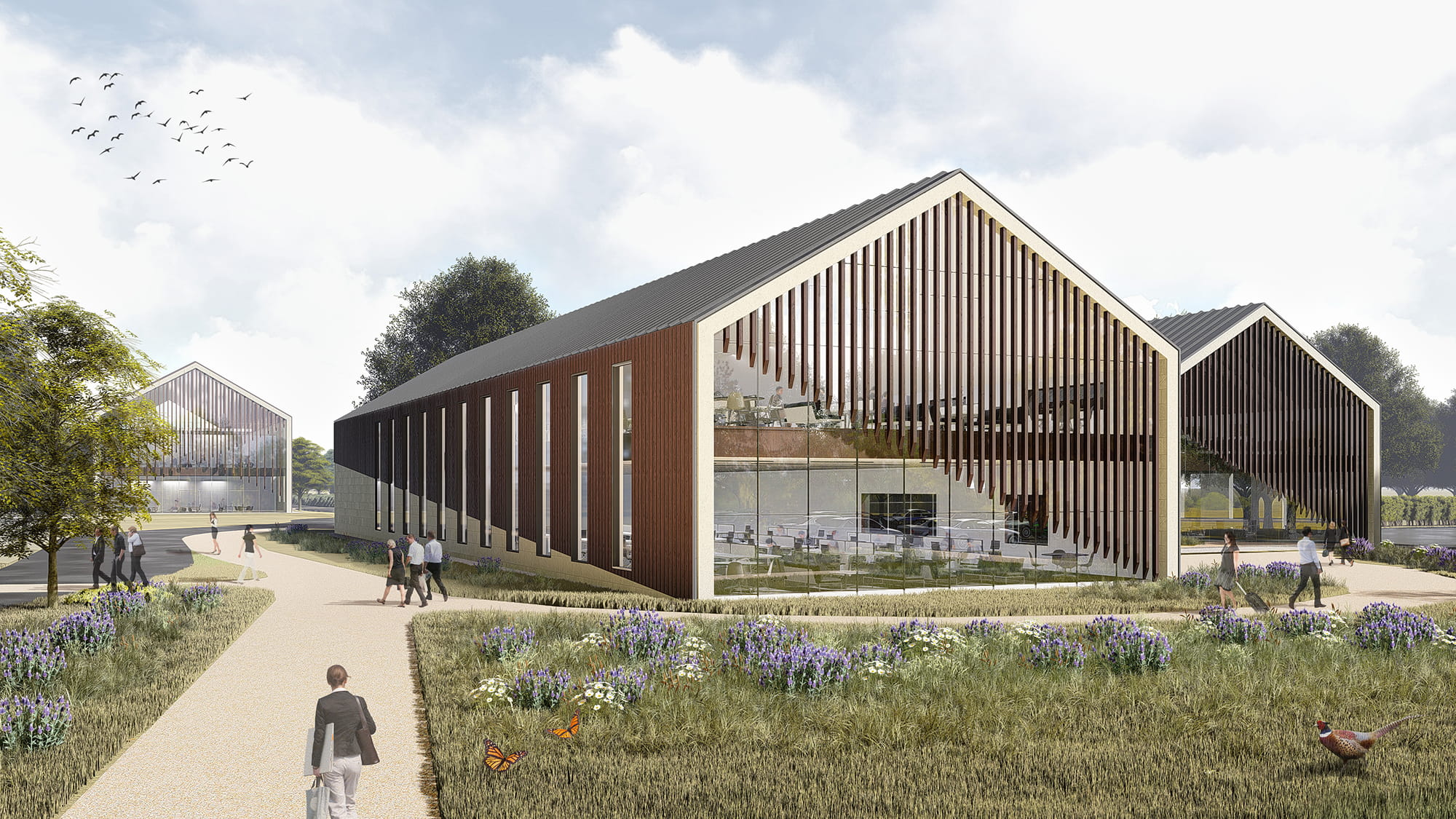 Modern educational buildings with large glass windows and wooden facades, surrounded by landscaped pathways and greenery, under a partly cloudy sky.