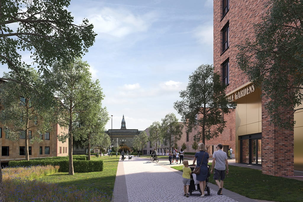 A landscaped pathway with trees and greenery, featuring families walking and a view of a building with "The Gardens" signage in the background.