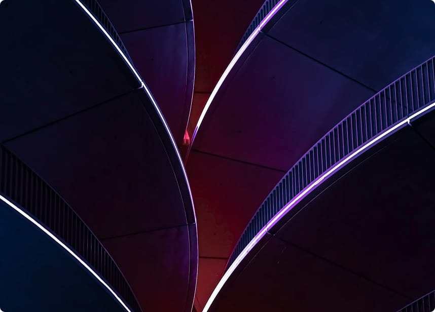 Abstract architectural design featuring curved structures illuminated with purple and blue lighting.